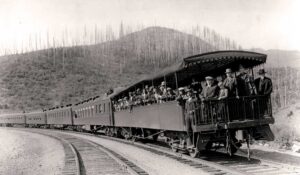 Beginning seasonally in the summer of 1931, the Great Northern Railway added open observation cars to its trains passing through Glacier National Park. Photo courtesy of the Runte Collection.