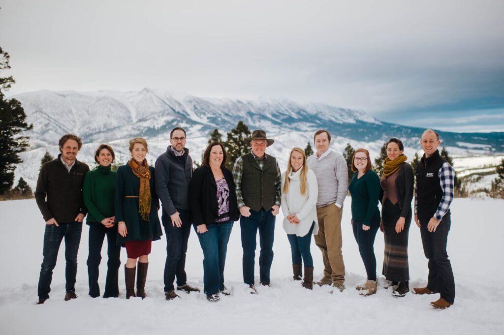PERC Staff standing in front of a Montana winter landscape